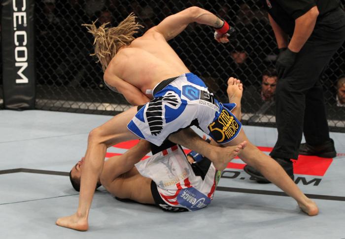 OMAHA, NE - FEBRUARY 15: (R-L) Jonathan Brookins knocks out Vagner Rocha with a punch on the ground during the UFC on FUEL TV event at Omaha Civic Auditorium on February 15, 2012 in Omaha, Nebraska. (Photo by Josh Hedges/Zuffa LLC/Zuffa LLC via Getty Im