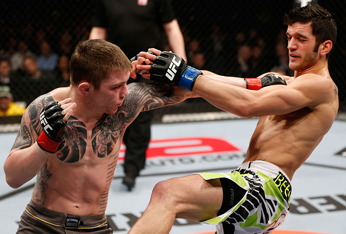 LONDON, ENGLAND - FEBRUARY 16: (L-R) Andy Ogle punches Josh Grispi in their featherweight fight during the UFC on Fuel TV event on February 16, 2013 at Wembley Arena in London, England. (Photo by Josh Hedges/Zuffa LLC/Zuffa LLC via Getty Images)