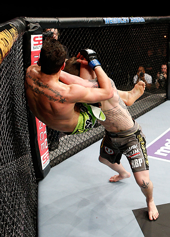 LONDON, ENGLAND - FEBRUARY 16: (R-L) Andy Ogle slams Josh Grispi in their featherweight fight during the UFC on Fuel TV event on February 16, 2013 at Wembley Arena in London, England. (Photo by Josh Hedges/Zuffa LLC/Zuffa LLC via Getty Images)