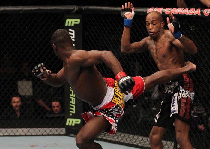 TORONTO, ON - DECEMBER 10: (L-R) Yves Jabouin kicks Walel Watson during the UFC 140 event at Air Canada Centre on December 10, 2011 in Toronto, Ontario, Canada. (Photo by Nick Laham/Zuffa LLC/Zuffa LLC via Getty Images)