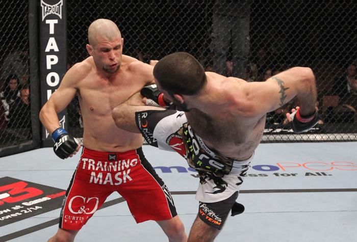 LAS VEGAS, NV - FEBRUARY 04: Matt Brown (right) kicks Chris Cope during the UFC 143 event at Mandalay Bay Events Center on February 4, 2012 in Las Vegas, Nevada. (Photo by Nick Laham/Zuffa LLC/Zuffa LLC via Getty Images) *** Local Caption *** Matt Brown