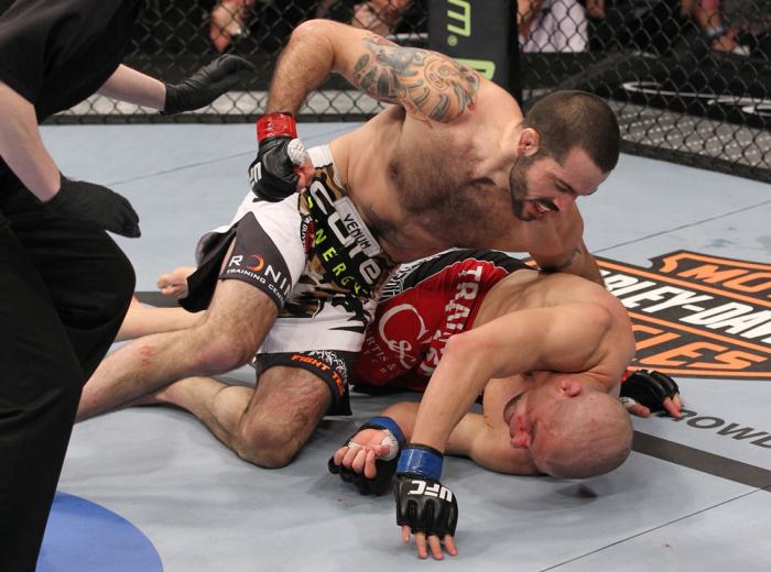 LAS VEGAS, NV - FEBRUARY 04: Matt Brown (white shorts) attempts to finish Chris Cope during the UFC 143 event at Mandalay Bay Events Center on February 4, 2012 in Las Vegas, Nevada. (Photo by Nick Laham/Zuffa LLC/Zuffa LLC via Getty Images) *** Local Ca