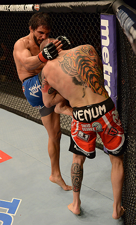 ANAHEIM, CA - FEBRUARY 23: Dennis Bermudez (left) knees Matt Grice in their featherweight bout during UFC 157 at Honda Center on February 23, 2013 in Anaheim, California. (Photo by Donald Miralle/Zuffa LLC/Zuffa LLC via Getty Images) *** Local Caption *
