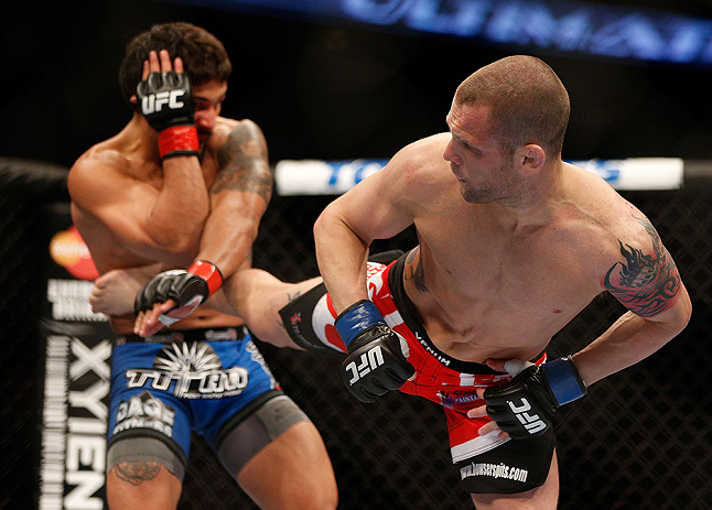 ANAHEIM, CA - FEBRUARY 23: Matt Grice (right) kicks Dennis Bermudez in their featherweight bout during UFC 157 at Honda Center on February 23, 2013 in Anaheim, California. (Photo by Josh Hedges/Zuffa LLC/Zuffa LLC via Getty Images) *** Local Caption ***