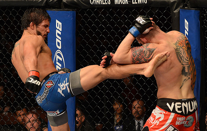 ANAHEIM, CA - FEBRUARY 23: (L-R) Dennis Bermudez (left) kicks Matt Grice in their featherweight bout during UFC 157 at Honda Center on February 23, 2013 in Anaheim, California. (Photo by Donald Miralle/Zuffa LLC/Zuffa LLC via Getty Images) *** Local Cap