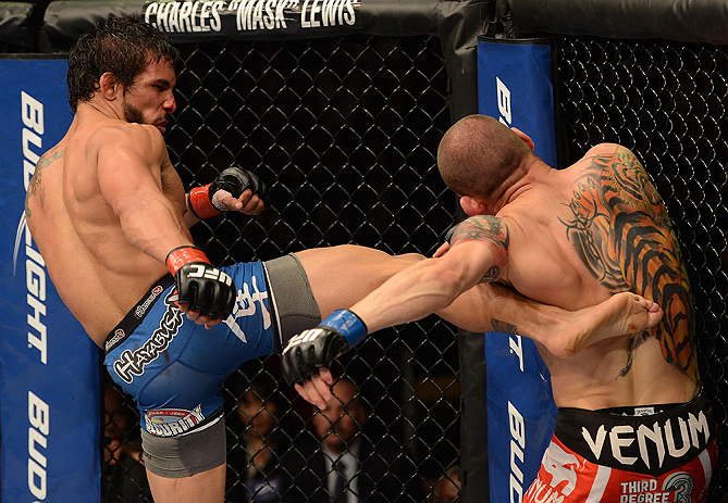 ANAHEIM, CA - FEBRUARY 23: (L-R) Dennis Bermudez (left) kicks Matt Grice in their featherweight bout during UFC 157 at Honda Center on February 23, 2013 in Anaheim, California. (Photo by Donald Miralle/Zuffa LLC/Zuffa LLC via Getty Images) *** Local Cap