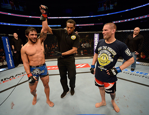 ANAHEIM, CA - FEBRUARY 23: Dennis Bermudez (left) reacts to his victory over Matt Grice (right) in their featherweight bout during UFC 157 at Honda Center on February 23, 2013 in Anaheim, California. (Photo by Donald Miralle/Zuffa LLC/Zuffa LLC via Gett