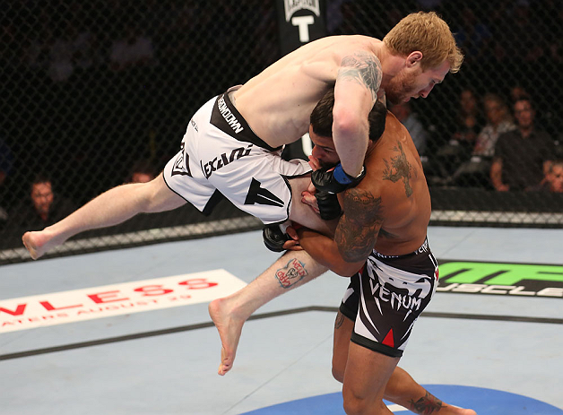 DENVER, CO - AUGUST 11: (R-L) Dennis Bermudez takes down Tommy Hayden during their featherweight bout at UFC 150 inside Pepsi Center on August 11, 2012 in Denver, Colorado. (Photo by Nick Laham/Zuffa LLC/Zuffa LLC via Getty Images)