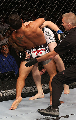 DENVER, CO - AUGUST 11: (L-R) Dennis Bermudez submits Tom Hayden with a guillotine choke during their featherweight bout at UFC 150 inside Pepsi Center on August 11, 2012 in Denver, Colorado. (Photo by Nick Laham/Zuffa LLC/Zuffa LLC via Getty Images)