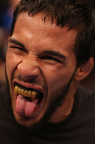 DENVER, CO - AUGUST 11: Dennis Bermudez reacts after submitting Tom Hayden during their featherweight bout at UFC 150 inside Pepsi Center on August 11, 2012 in Denver, Colorado. (Photo by Nick Laham/Zuffa LLC/Zuffa LLC via Getty Images)