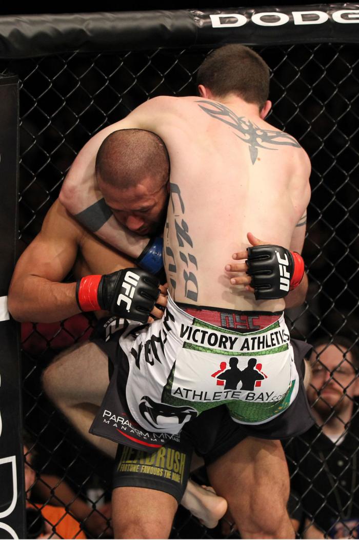 OMAHA, NE - FEBRUARY 15: (R-L) John Albert attempts a guillotine choke submission against Ivan Menjivar during the UFC on FUEL TV event at Omaha Civic Auditorium on February 15, 2012 in Omaha, Nebraska. (Photo by Josh Hedges/Zuffa LLC/Zuffa LLC via Gett