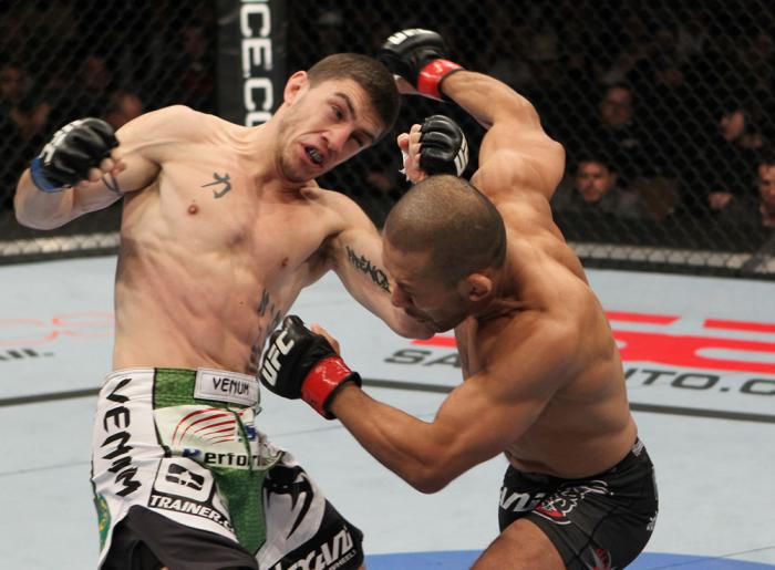 OMAHA, NE - FEBRUARY 15: (L-R) John Albert and Ivan Menjivar trade punches during the UFC on FUEL TV event at Omaha Civic Auditorium on February 15, 2012 in Omaha, Nebraska. (Photo by Josh Hedges/Zuffa LLC/Zuffa LLC via Getty Images) *** Local Caption *
