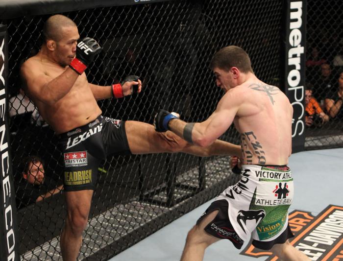 OMAHA, NE - FEBRUARY 15: (L-R) Ivan Menjivar kicks John Albert during the UFC on FUEL TV event at Omaha Civic Auditorium on February 15, 2012 in Omaha, Nebraska. (Photo by Josh Hedges/Zuffa LLC/Zuffa LLC via Getty Images) *** Local Caption *** Ivan Menj