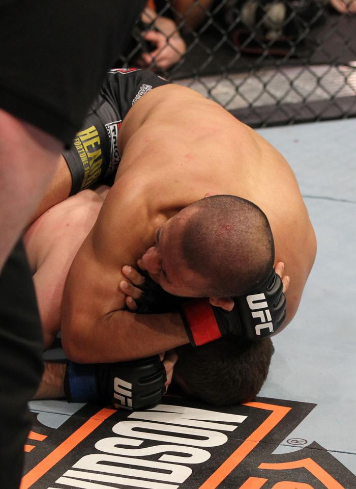 OMAHA, NE - FEBRUARY 15: Ivan Menjivar defeats John Albert with a rear choke submission during the UFC on FUEL TV event at Omaha Civic Auditorium on February 15, 2012 in Omaha, Nebraska. (Photo by Josh Hedges/Zuffa LLC/Zuffa LLC via Getty Images) *** Lo