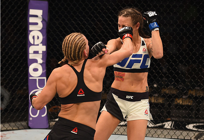 LAS VEGAS, NV - JANUARY 02: (L-R) Justine Kish punches Nina Ansaroff in their women's strawweight bout during the UFC 195 event inside MGM Grand Garden Arena on January 2, 2016 in Las Vegas, Nevada. (Photo by Josh Hedges/Zuffa LLC/Zuffa LLC via Getty Ima