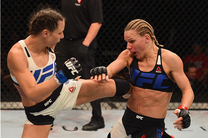 LAS VEGAS, NV - JANUARY 02: (L-R) Nina Ansaroff kicks Justine Kish in their women's strawweight bout during the UFC 195 event inside MGM Grand Garden Arena on January 2, 2016 in Las Vegas, Nevada. (Photo by Josh Hedges/Zuffa LLC/Zuffa LLC via Getty Image