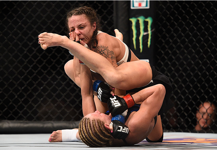 LAS VEGAS, NV - JANUARY 02: Justine Kish (bottom) attempts to submit Nina Ansaroff in their women's strawweight bout during the UFC 195 event inside MGM Grand Garden Arena on January 2, 2016 in Las Vegas, Nevada. (Photo by Jeff Bottari/Zuffa LLC/Zuffa LL