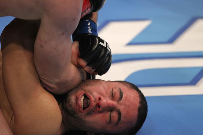 TORONTO, ON - DECEMBER 10: John Makdessi absorbs an elbow strike from Dennis Hallman during the UFC 140 event at Air Canada Centre on December 10, 2011 in Toronto, Ontario, Canada. (Photo by Nick Laham/Zuffa LLC/Zuffa LLC via Getty Images)