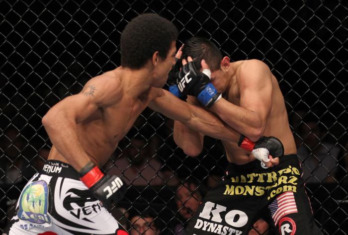LAS VEGAS, NV - FEBRUARY 04: Alex Caceres (left) punches Edwin Figueroa during the UFC 143 event at Mandalay Bay Events Center on February 4, 2012 in Las Vegas, Nevada. (Photo by Nick Laham/Zuffa LLC/Zuffa LLC via Getty Images) *** Local Caption *** Ale
