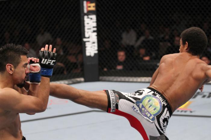 LAS VEGAS, NV - FEBRUARY 04: Alex Caceres (right) kicks Edwin Figueroa during the UFC 143 event at Mandalay Bay Events Center on February 4, 2012 in Las Vegas, Nevada. (Photo by Nick Laham/Zuffa LLC/Zuffa LLC via Getty Images) *** Local Caption *** Alex