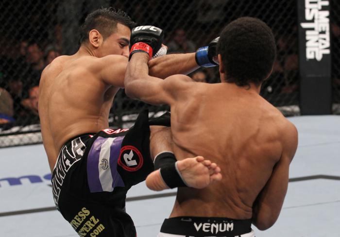 LAS VEGAS, NV - FEBRUARY 04: Edwin Figueroa (left) kicks Alex Caceres during the UFC 143 event at Mandalay Bay Events Center on February 4, 2012 in Las Vegas, Nevada. (Photo by Nick Laham/Zuffa LLC/Zuffa LLC via Getty Images) *** Local Caption *** Edwin