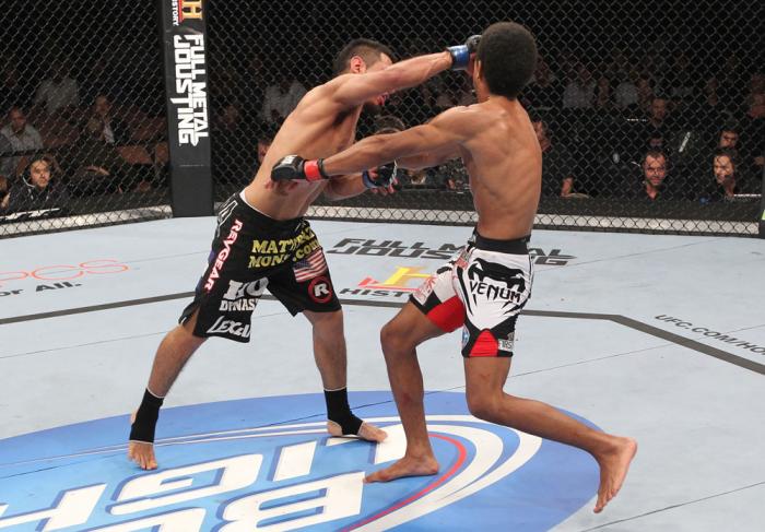 LAS VEGAS, NV - FEBRUARY 04: Edwin Figueroa (left) punches Alex Caceres during the UFC 143 event at Mandalay Bay Events Center on February 4, 2012 in Las Vegas, Nevada. (Photo by Nick Laham/Zuffa LLC/Zuffa LLC via Getty Images) *** Local Caption *** Edw