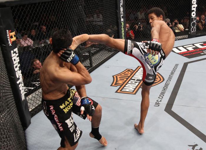LAS VEGAS, NV - FEBRUARY 04: Alex Caceres (right) kicks Edwin Figueroa during the UFC 143 event at Mandalay Bay Events Center on February 4, 2012 in Las Vegas, Nevada. (Photo by Nick Laham/Zuffa LLC/Zuffa LLC via Getty Images) *** Local Caption *** Alex