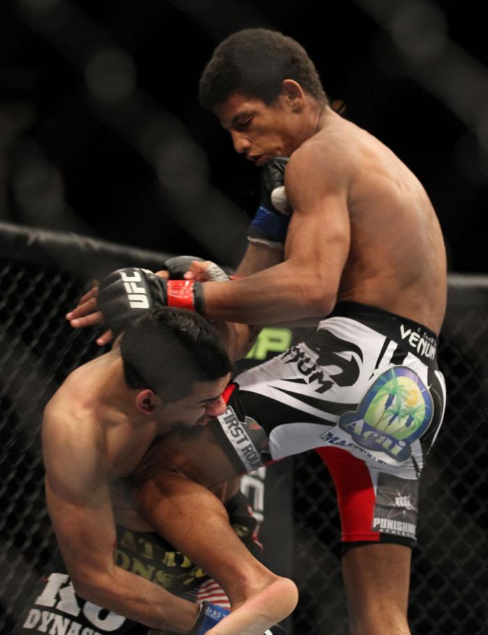 LAS VEGAS, NV - FEBRUARY 04: Alex Caceres (white shorts) and Edwin Figueroa exchange blows during the UFC 143 event at Mandalay Bay Events Center on February 4, 2012 in Las Vegas, Nevada. (Photo by Josh Hedges/Zuffa LLC/Zuffa LLC via Getty Images) *** L