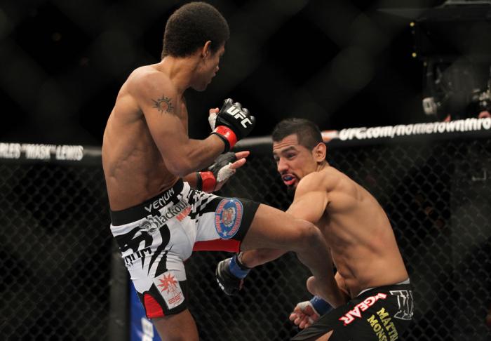 LAS VEGAS, NV - FEBRUARY 04: Alex Caceres (left) kicks Edwin Figueroa during the UFC 143 event at Mandalay Bay Events Center on February 4, 2012 in Las Vegas, Nevada. (Photo by Josh Hedges/Zuffa LLC/Zuffa LLC via Getty Images) *** Local Caption *** Alex