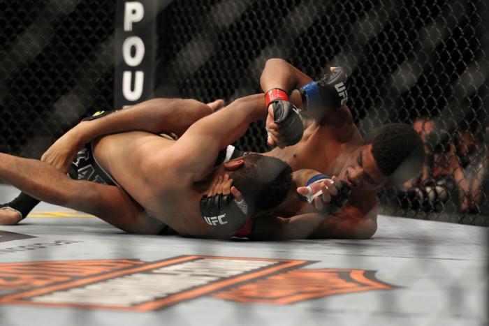 LAS VEGAS, NV - FEBRUARY 04: Alex Caceres (right) throws punches at Edwin Figueroa on the ground during the UFC 143 event at Mandalay Bay Events Center on February 4, 2012 in Las Vegas, Nevada. (Photo by Josh Hedges/Zuffa LLC/Zuffa LLC via Getty Images)