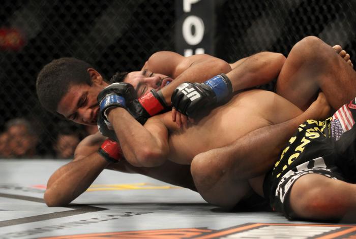 LAS VEGAS, NV - FEBRUARY 04: Alex Caceres (left) attempts to submit Edwin Figueroa during the UFC 143 event at Mandalay Bay Events Center on February 4, 2012 in Las Vegas, Nevada. (Photo by Josh Hedges/Zuffa LLC/Zuffa LLC via Getty Images) *** Local Cap