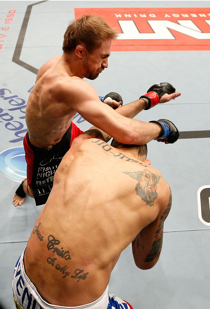 BELO HORIZONTE, BRAZIL - SEPTEMBER 04: (L-R) Ali Bagautinov punches Marcos Vinicius in their flyweight fight during the UFC on FOX Sports 1 event at Mineirinho Arena on September 4, 2013 in Belo Horizonte, Brazil. (Photo by Josh Hedges/Zuffa LLC/Zuffa LL