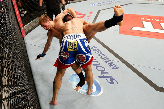 BELO HORIZONTE, BRAZIL - SEPTEMBER 04: (R-L) Marcos Vinicius takes down Ali Bagautinov in their flyweight fight during the UFC on FOX Sports 1 event at Mineirinho Arena on September 4, 2013 in Belo Horizonte, Brazil. (Photo by Josh Hedges/Zuffa LLC/Zuffa