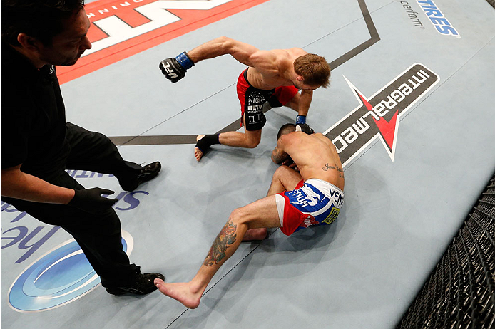 BELO HORIZONTE, BRAZIL - SEPTEMBER 04: (L-R) Ali Bagautinov punches Marcos Vinicius in their flyweight fight during the UFC on FOX Sports 1 event at Mineirinho Arena on September 4, 2013 in Belo Horizonte, Brazil. (Photo by Josh Hedges/Zuffa LLC/Zuffa LL