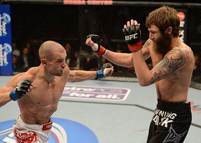 ANAHEIM, CA - FEBRUARY 23: (L-R) Anton Kuivanen punches Michael Chiesa in their lightweight bout during UFC 157 at Honda Center on February 23, 2013 in Anaheim, California. (Photo by Donald Miralle/Zuffa LLC/Zuffa LLC via Getty Images) *** Local Caption