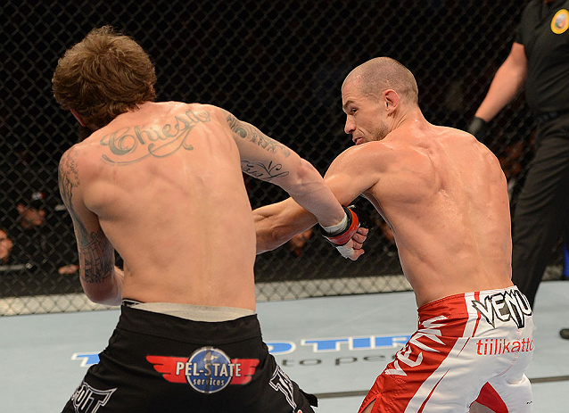 ANAHEIM, CA - FEBRUARY 23: (R-L) Anton Kuivanen punches Michael Chiesa in their lightweight bout during UFC 157 at Honda Center on February 23, 2013 in Anaheim, California. (Photo by Donald Miralle/Zuffa LLC/Zuffa LLC via Getty Images) *** Local Caption