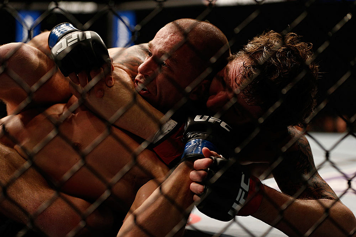 ANAHEIM, CA - FEBRUARY 23: (R-L) Michael Chiesa attempts to submit Anton Kuivanen in their lightweight bout during UFC 157 at Honda Center on February 23, 2013 in Anaheim, California. (Photo by Josh Hedges/Zuffa LLC/Zuffa LLC via Getty Images) *** Local