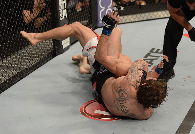 ANAHEIM, CA - FEBRUARY 23: Michael Chiesa attempts to submit Anton Kuivanen in their lightweight bout during UFC 157 at Honda Center on February 23, 2013 in Anaheim, California. (Photo by Donald Miralle/Zuffa LLC/Zuffa LLC via Getty Images) *** Local Ca