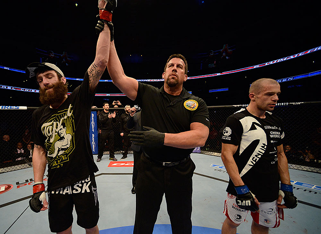 ANAHEIM, CA - FEBRUARY 23: Michael Chiesa (left) is named the winner over Anton Kuivanen (right) after their lightweight bout during UFC 157 at Honda Center on February 23, 2013 in Anaheim, California. (Photo by Donald Miralle/Zuffa LLC/Zuffa LLC via Ge
