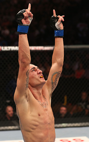 DENVER, CO - AUGUST 11: Max Holloway reacts after knocking out Justin Lawrence during their featherweight bout at UFC 150 inside Pepsi Center on August 11, 2012 in Denver, Colorado. (Photo by Nick Laham/Zuffa LLC/Zuffa LLC via Getty Images)