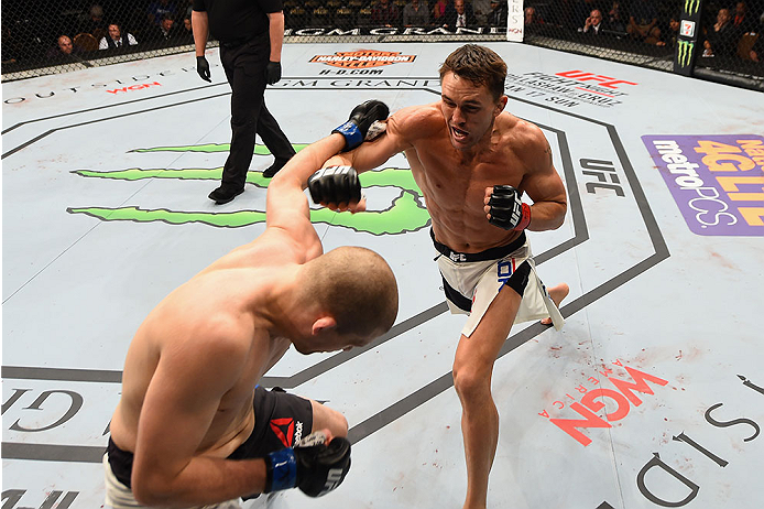 LAS VEGAS, NV - JANUARY 02: (R-L) Kyle Noke of Australia punches Alex Morono in their welterweight bout during the UFC 195 event inside MGM Grand Garden Arena on January 2, 2016 in Las Vegas, Nevada. (Photo by Josh Hedges/Zuffa LLC/Zuffa LLC via Getty Im