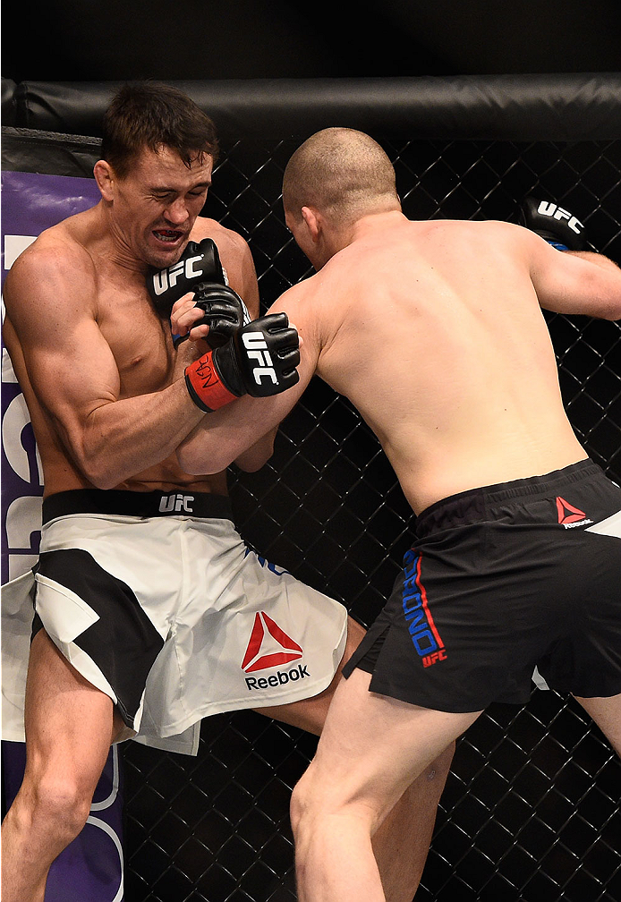 LAS VEGAS, NV - JANUARY 02: (R-L) Alex Morono punches Kyle Noke of Australia in their welterweight bout during the UFC 195 event inside MGM Grand Garden Arena on January 2, 2016 in Las Vegas, Nevada. (Photo by Jeff Bottari/Zuffa LLC/Zuffa LLC via Getty I