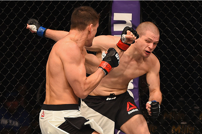 LAS VEGAS, NV - JANUARY 02: (L-R) Kyle Noke of Australia punches Alex Morono in their welterweight bout during the UFC 195 event inside MGM Grand Garden Arena on January 2, 2016 in Las Vegas, Nevada. (Photo by Josh Hedges/Zuffa LLC/Zuffa LLC via Getty Im