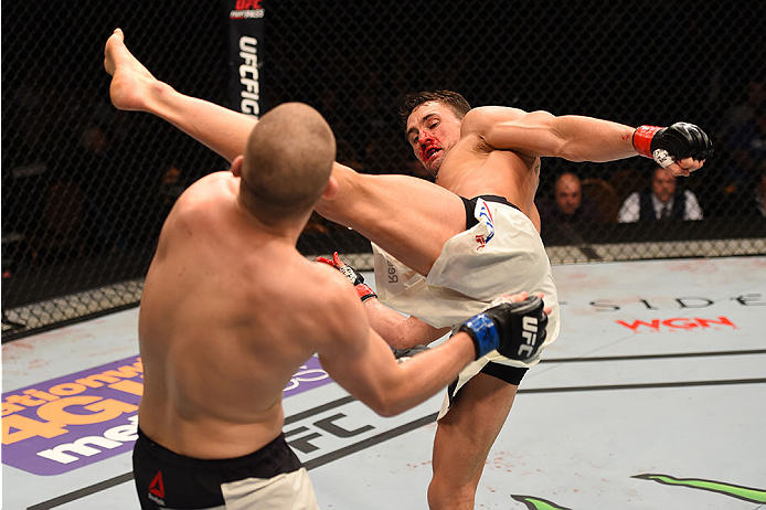 LAS VEGAS, NV - JANUARY 02: (R-L) Kyle Noke of Australia kicks Alex Morono in their welterweight bout during the UFC 195 event inside MGM Grand Garden Arena on January 2, 2016 in Las Vegas, Nevada. (Photo by Josh Hedges/Zuffa LLC/Zuffa LLC via Getty Ima