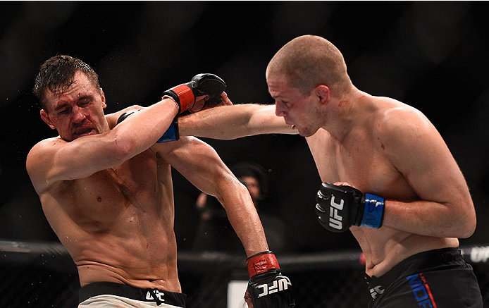 LAS VEGAS, NV - JANUARY 02: (R-L) Alex Morono punches Kyle Noke of Australia in their welterweight bout during the UFC 195 event inside MGM Grand Garden Arena on January 2, 2016 in Las Vegas, Nevada. (Photo by Jeff Bottari/Zuffa LLC/Zuffa LLC via Getty I