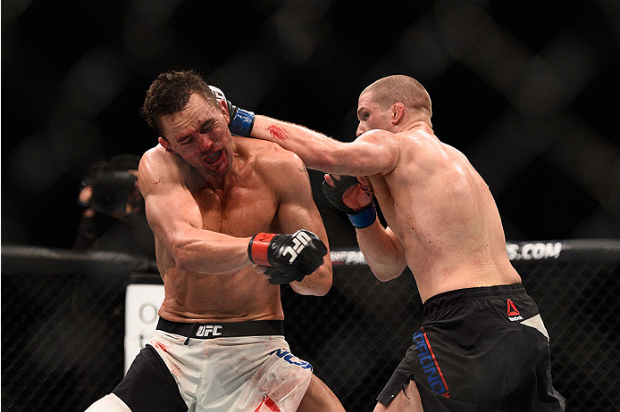 LAS VEGAS, NV - JANUARY 02: (R-L) Alex Morono punches Kyle Noke of Australia in their welterweight bout during the UFC 195 event inside MGM Grand Garden Arena on January 2, 2016 in Las Vegas, Nevada. (Photo by Jeff Bottari/Zuffa LLC/Zuffa LLC via Getty I
