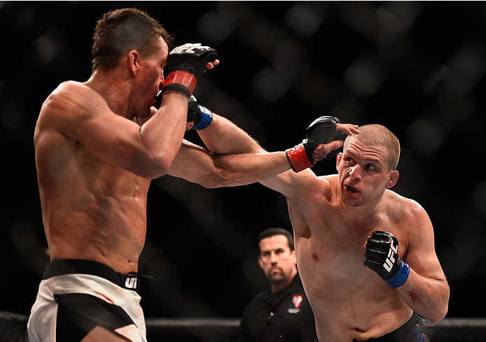 LAS VEGAS, NV - JANUARY 02: (R-L) Alex Morono punches Kyle Noke of Australia in their welterweight bout during the UFC 195 event inside MGM Grand Garden Arena on January 2, 2016 in Las Vegas, Nevada. (Photo by Jeff Bottari/Zuffa LLC/Zuffa LLC via Getty I