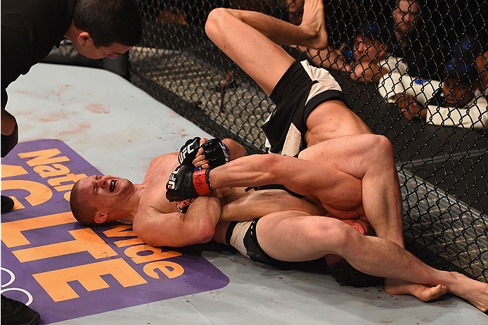 LAS VEGAS, NV - JANUARY 02: Alex Morono (left) attempts to submit Kyle Noke of Australia in their welterweight bout during the UFC 195 event inside MGM Grand Garden Arena on January 2, 2016 in Las Vegas, Nevada. (Photo by Josh Hedges/Zuffa LLC/Zuffa LLC