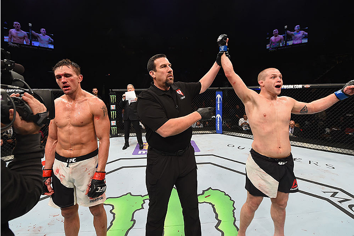 LAS VEGAS, NV - JANUARY 02: Alex Morono (right) reacts to his victory over Kyle Noke of Australia (left) in their welterweight bout during the UFC 195 event inside MGM Grand Garden Arena on January 2, 2016 in Las Vegas, Nevada. (Photo by Josh Hedges/Zuff