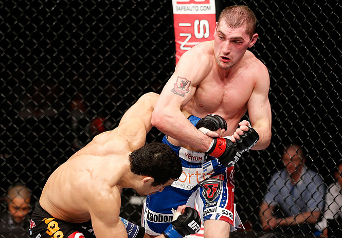 LONDON, ENGLAND - FEBRUARY 16: (R-L) Paul Sass punches Danny Castillo in their lightweight fight during the UFC on Fuel TV event on February 16, 2013 at Wembley Arena in London, England. (Photo by Josh Hedges/Zuffa LLC/Zuffa LLC via Getty Images)